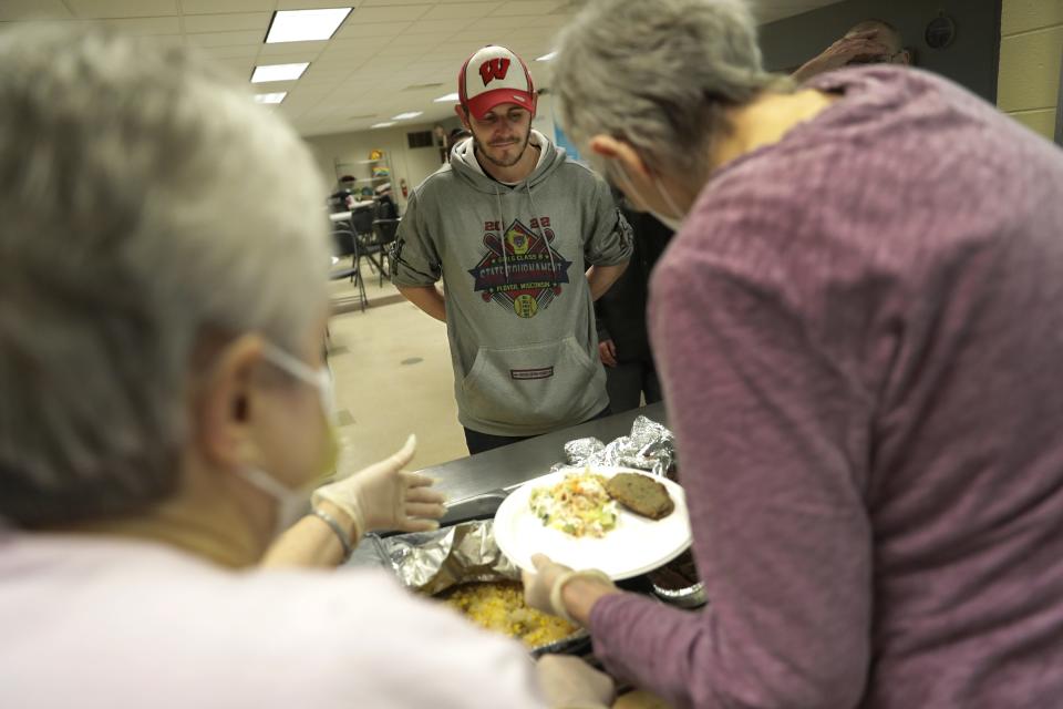 Robert Duval waits in line for a meal Wednesday, February 15, 2023, at the Salvation Army warming shelter located at 237 N. Macy Street in Fond du Lac, Wis.