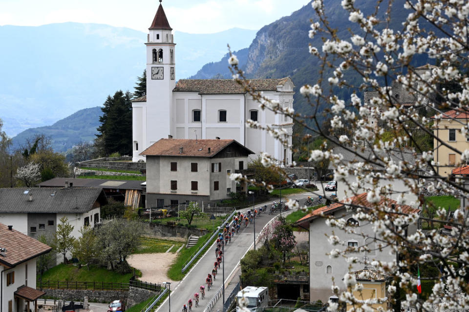 BRENTONICO SAN VALENTINO ITALY  APRIL 19 A general view of the peloton passing through a Castellano village during the 46th Tour of the Alps 2023 Stage 3 a 1625km stage from Ritten to Brentonico San Valentino 1321m on April 19 2023 in Brentonico San Valentino Italy Photo by Tim de WaeleGetty Images