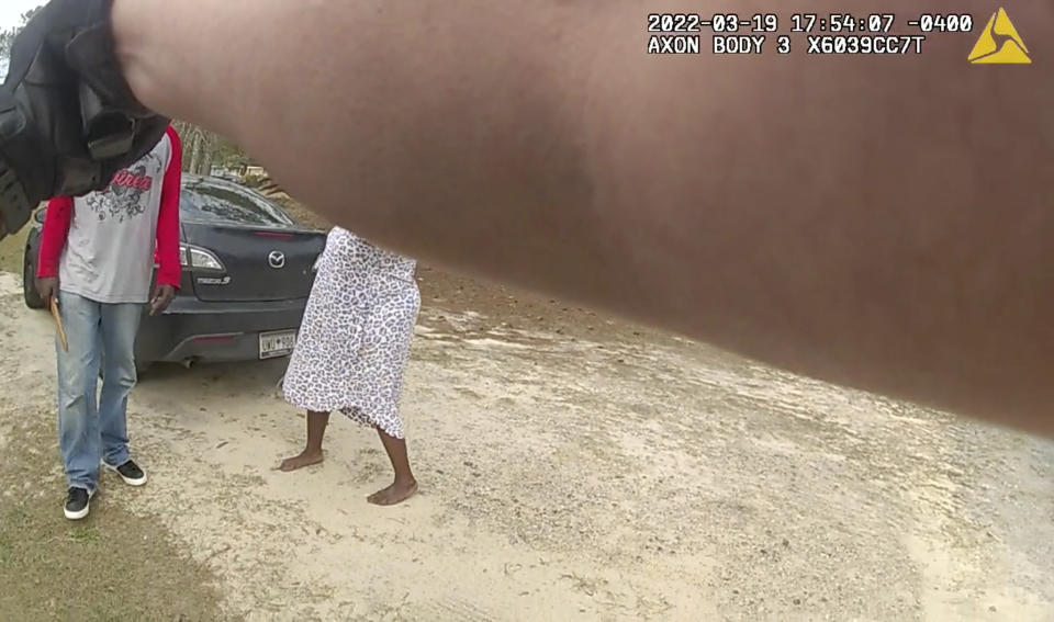 In this image from the body camera video of Richland County Sherrif's Deputy John Anderson, Irvin D. Moorer Charley, 34, holds a piece of wood as he walks towards Anderson, who is backpedaling, in Columbia, S.C. Moorer Charley was shot and killed after deputies responded to a call about domestic violence. (Deputy John Anderson/Richland County Sheriff's Department via AP)