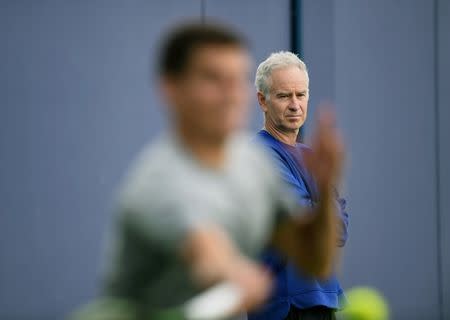 Britain Tennis - Aegon Championships - Queens Club, London - 13/6/16 John McEnroe watches Canada's Milos Raonic during a practice session Action Images via Reuters / Tony O'Brien