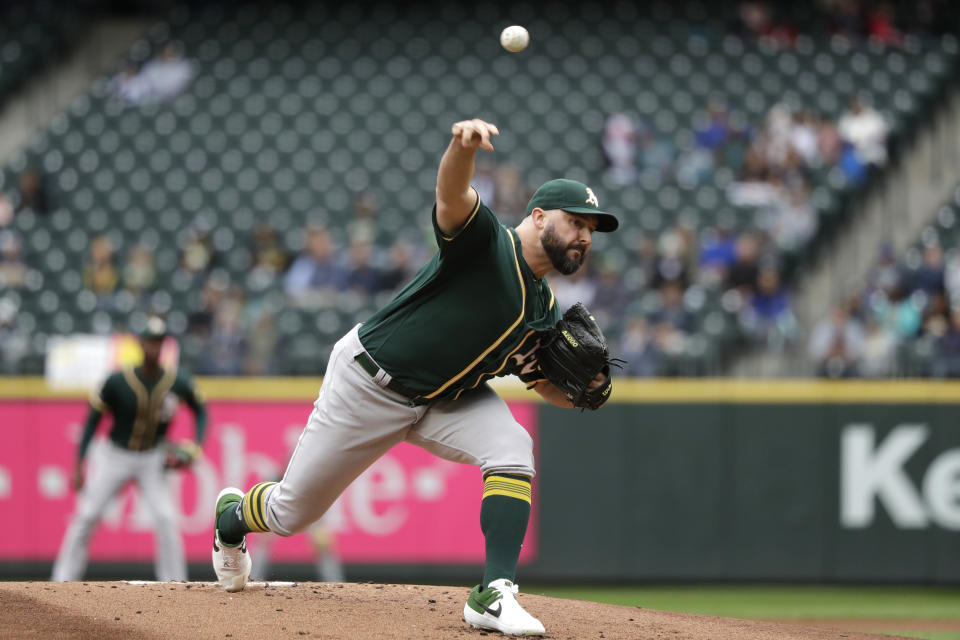 Oakland Athletics starting pitcher Tanner Roark throws against the Seattle Mariners in the first inning of a baseball game Sunday, Sept. 29, 2019, in Seattle. (AP Photo/Elaine Thompson)