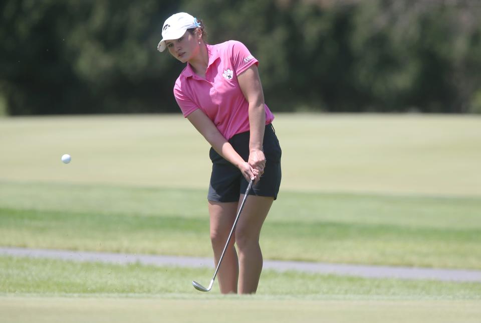 Nevada's Olivia Axmear looks at the ball after a chip onto the 4th hole during the Class 3A girls state golf tournament at the Pheasant Ridge Golf Course on Friday, May 26, 2023, in Cedar Falls, Iowa.