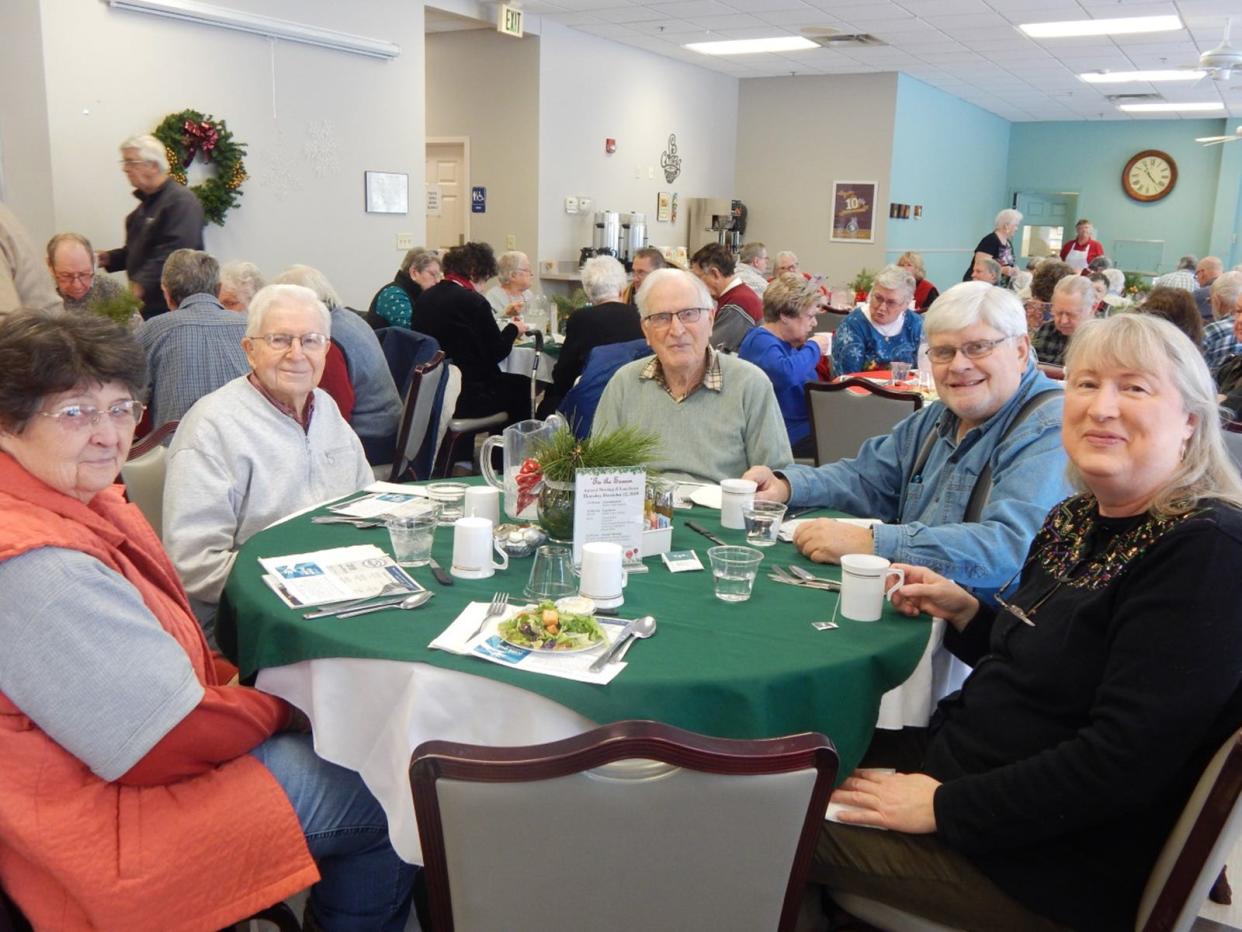 People enjoy the holiday luncheon at the 2019 ‘Tis the Season event.