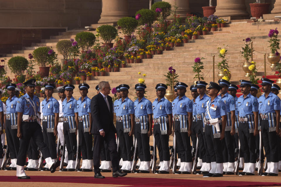 Australian Prime Minister Anthony Albanese inspects a joint military guard of honour during his ceremonial reception at the Indian presidential palace, in New Delhi, India, Friday, March 10, 2023. Australia is striving to strengthen security cooperation with India and also deepen economic and cultural ties, Prime Minister Anthony Albanese said on Friday. (AP Photo/Manish Swarup)