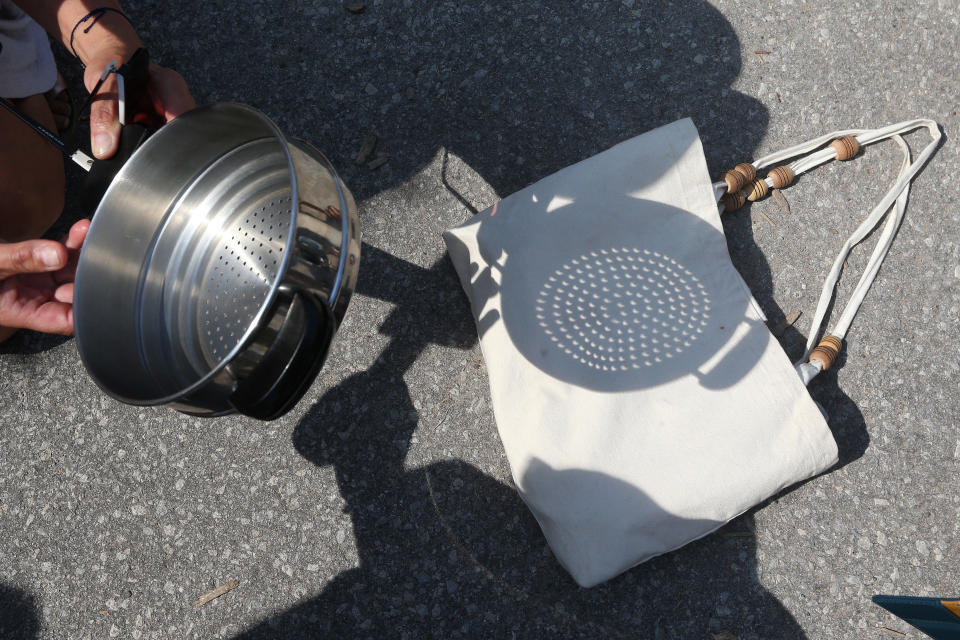 A steaming pot shows the eclipse in its shadows on Aug. 21, 2017 at the University of Toronto. Canada experienced a partial solar eclipse in 2017. / Credit: Steve Russell/Toronto Star via Getty Images