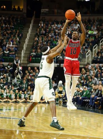 FILE PHOTO: Dec 29, 2018; East Lansing, MI, USA; Northern Illinois Huskies guard Eugene German (10) attempts a three point basket against Michigan State Spartans guard Cassius Winston (5) during the first half of a game at the Breslin Center. Mandatory Credit: Mike Carter-USA TODAY Sports