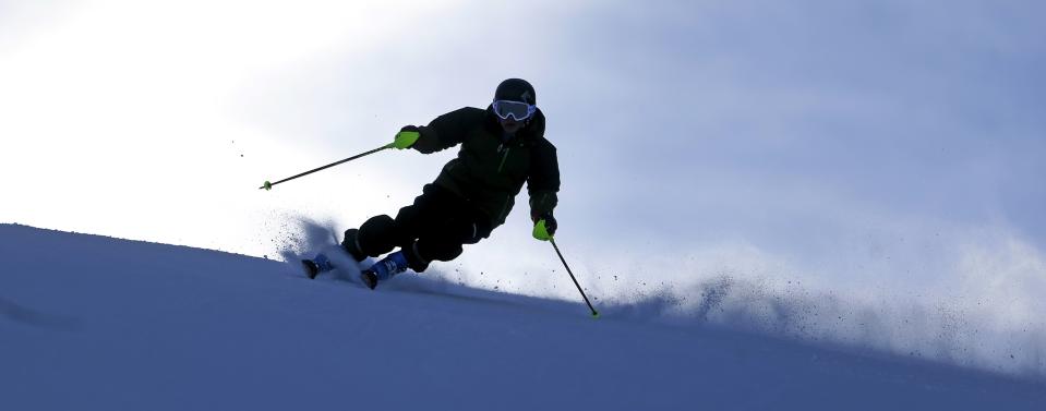 FILE - This Nov. 23, 2013, file photo, shows a skier at Park City Mountain Resort, in Park City, Utah. A coalition of Utah ski resort managers from Alta Ski Area, Brighton Resort, Canyons Resort, Deer Valley Resort, Park City Mountain Resort, Snowbird Ski and Summer Resort and Solitude Mountain Resort are reviving their plans for a series of interconnected chairlifts that would link seven ski areas that would give the state a Euro-style experience. (AP Photo/Rick Bowmer, File)