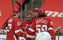 Detroit Red Wings right wing Anthony Mantha, second from right, celebrates his second-period goal against the Columbus Blue Jackets with defenseman Filip Hronek (17), center Dylan Larkin (71), and left-wing Tyler Bertuzzi (59) during an NHL hockey game Tuesday, Jan. 19, 2021, in Detroit. (AP Photo/Duane Burleson)