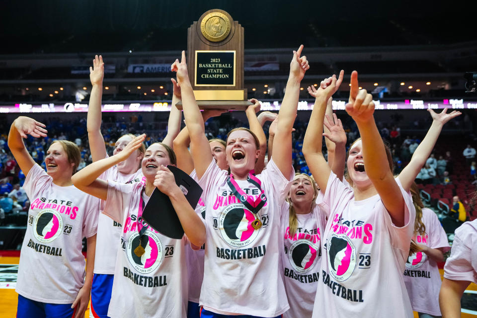 Sioux Center players celebrate after defeating Benton in the Class 3A championship game at Wells Fargo Arena.