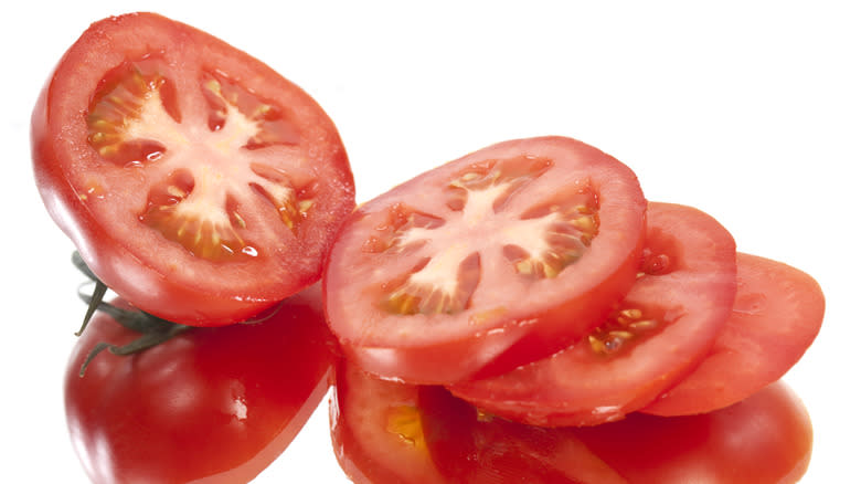 A sliced red tomato