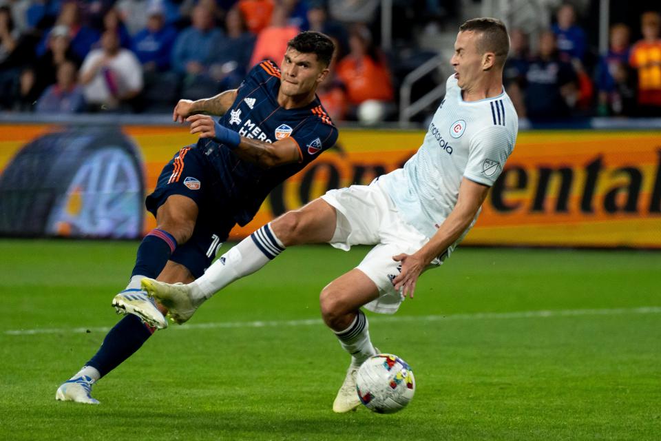 FC Cincinnati forward Brandon Vazquez (19) scores a goal passed Chicago Fire defender Boris Sekulic (2) in the second half of the MLS match at TQL Stadium in Cincinnati on Saturday, Oct. 1, 2022. Chicago Fire defeated FC Cincinnati 3-2.