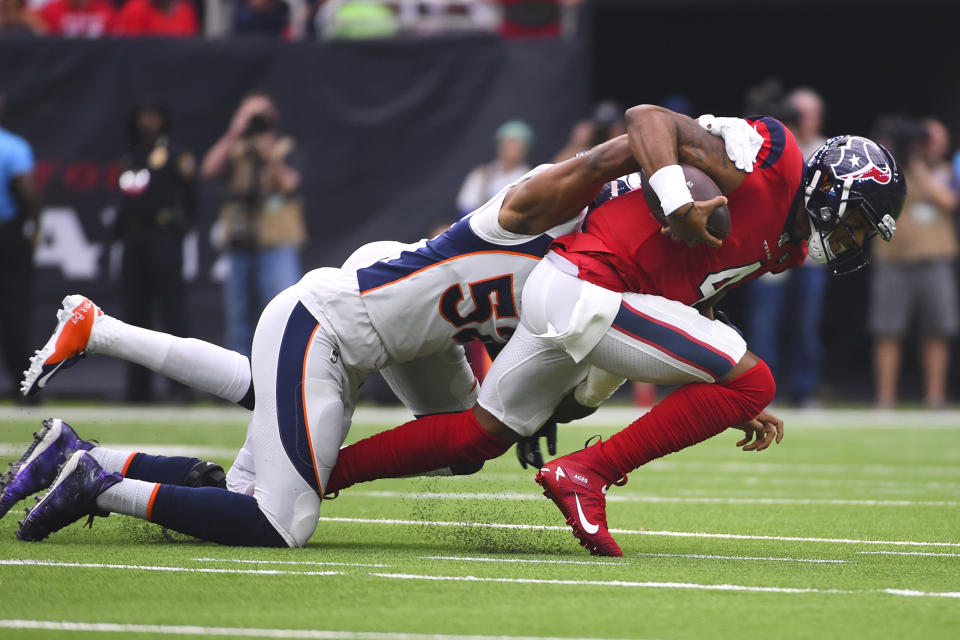 Houston Texans quarterback Deshaun Watson (4) is sacked by Denver Broncos linebacker Justin Hollins (52) during the first half of an NFL football game Sunday, Dec. 8, 2019, in Houston. (AP Photo/Eric Christian Smith)