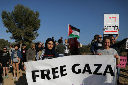 Left-wing activists take part in a protest in solidarity with Palestinians living in Gaza, next to the Gaza-Israel border, near Kibbutz Nahal Oz, Israel March 31, 2018. REUTERS/Ammar Awad