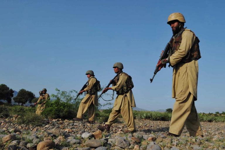 Pakistani soldiers on patrol during the military operation against Taliban militants in the Kurram tribal region, on July 9, 2011
