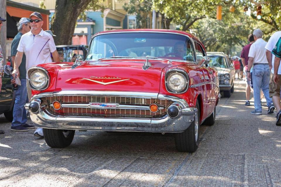 An old Chevy cruises on Washington Avenue in Ocean Springs during Cruisin’ the Coast Block Party in 2021.