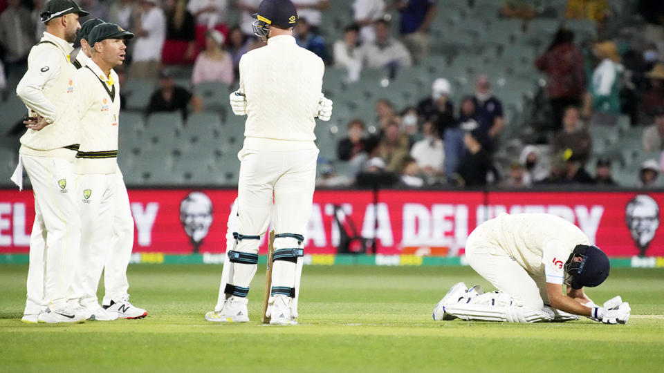 Players, pictured here looking on after Joe Root's horror low blow in the second Ashes Test.