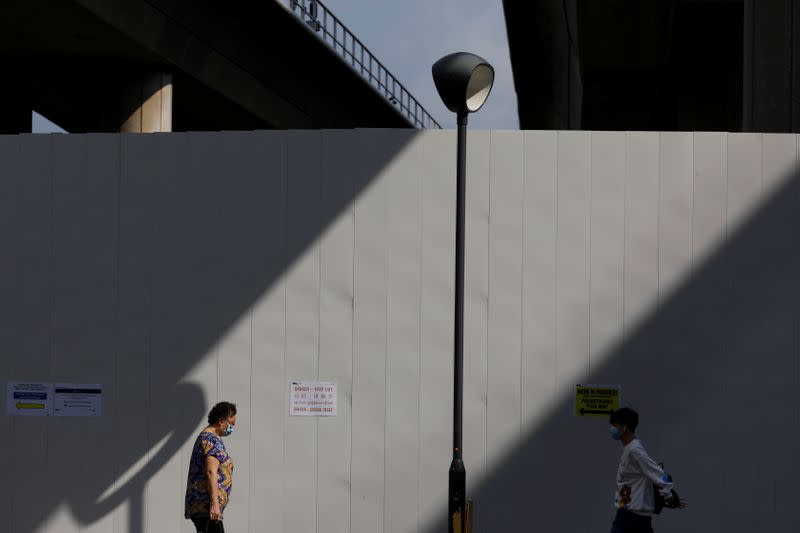 Commuters leave a train station during the coronavirus disease (COVID-19) outbreak, in Singapore