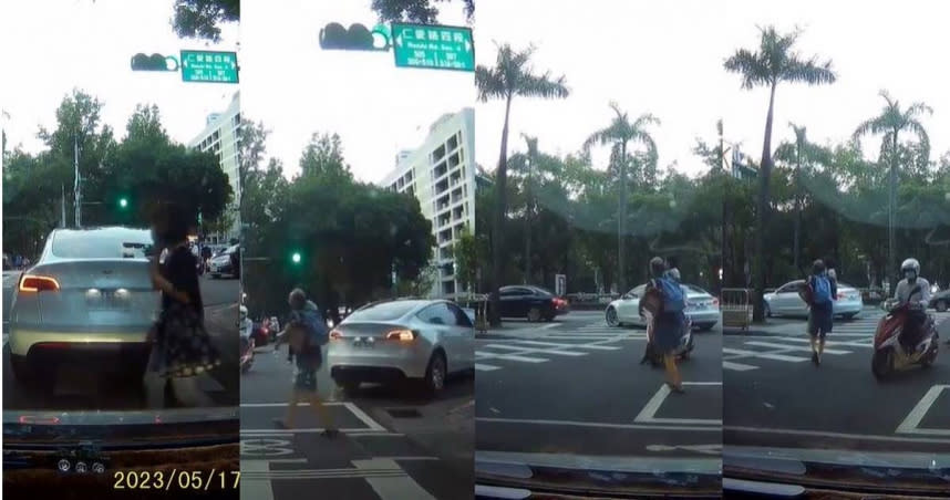 一名男網友在台北市信義區的一處路口，瞥見兩名民眾先後不顧紅燈亮起，執意穿越馬路，其中一名中年男子的懷中還抱著孩子，讓他痛批「皇帝行人」。（圖／翻攝自「爆料公社」臉書）