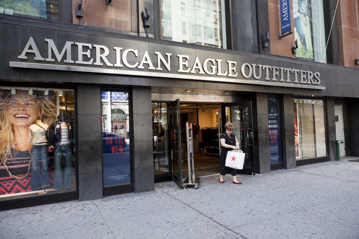 New York, New York, USA - October 2, 2011: A woman exits an American Eagle Outfitters store on 34th street in New York City. American Eagle Outfitters is a large chain offering men\'s and women\'s clothing and accessories.