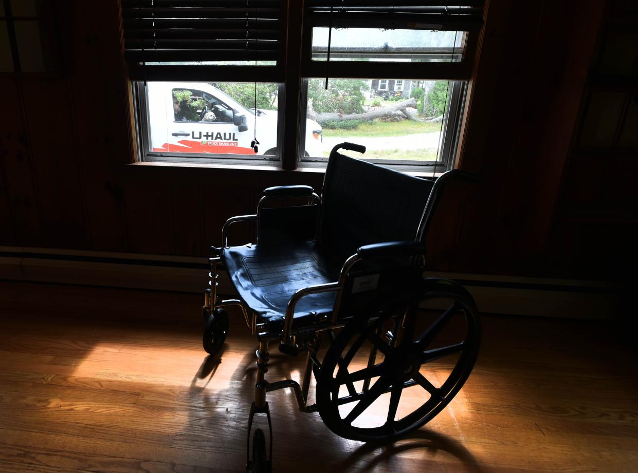 George Paznola, who is blind with stage 4 kidney cancer, waits in a rental truck with his belongings and dog Tallulah, with his wheelchair among the final items to be packed. Following court proceedings, he and his sister Alessandra Dabliz were evicted from a house on Dunns Pond Road in Hyannis.