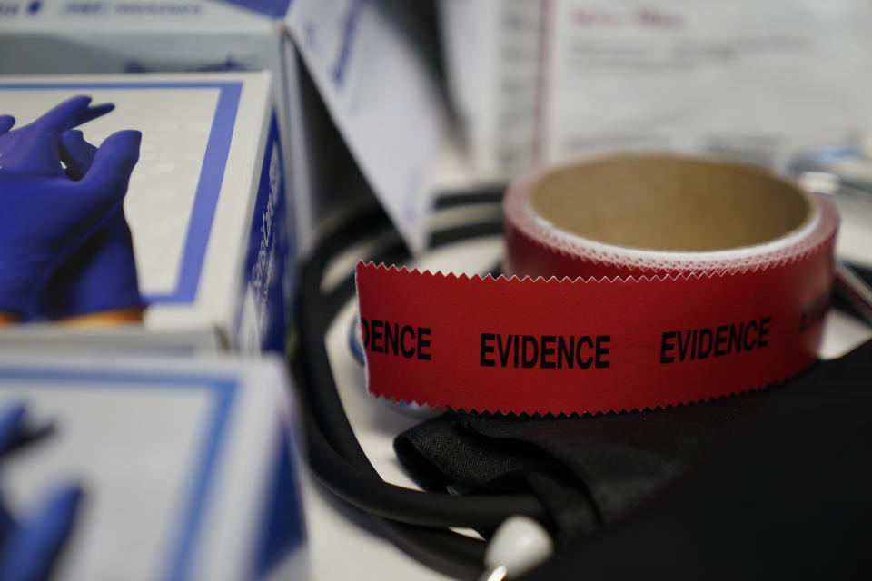 Evidence tape is seen with a Sexual Assault Evidence Collection Kit in an examination room, Wednesday, Aug. 31, 2022, in Austin, Texas. After a Texas law banning abortions past about six weeks, even in cases of rape or incest, went into effect a year ago, Gov. Greg Abbott said the state would strive to "eliminate all rapists from the streets." (AP Photo/Eric Gay)