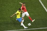 <p>Brazil’s Thiago Silva, left, slips the ball past Switzerland’s Haris Seferovic </p>