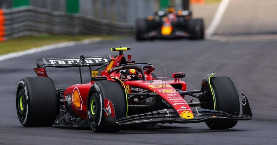 Carlos Sainz, Ferrari, Red Bull in background. Italy, September 2023. Credit: Alamy