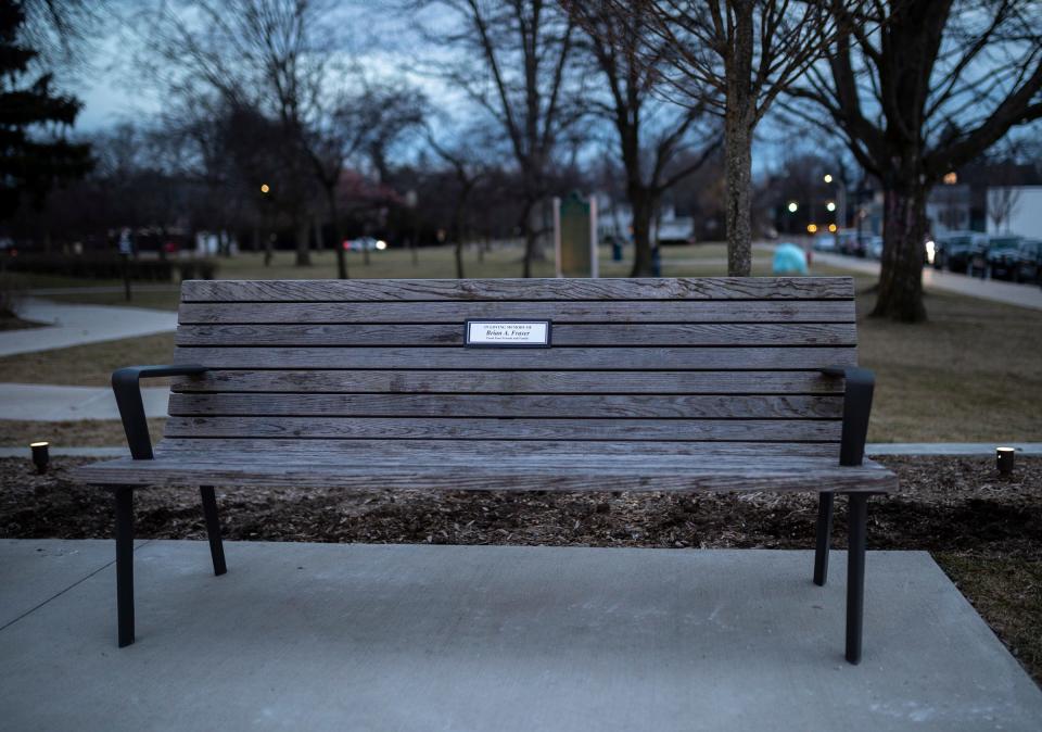 A bench with a plaque in Brian Fraser's memory sits outside Grosse Pointe South High School in Grosse Pointe Farms on Thursday, Feb. 8, 2024. Friends of Fraser's paid for the bench using the proceeds of wristbands and sweatshirts they made.