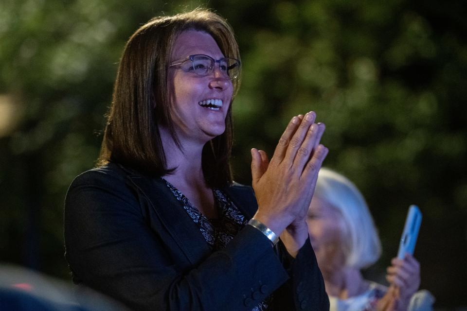 Allison Scott claps while listening to Jasmine Beach-Ferrara following the results of the Democratic primary May 17, 2022.