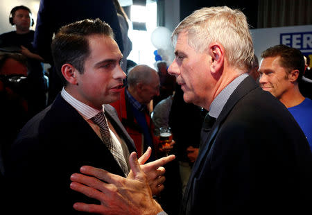 Tom Van Grieken, President of the far-right Flemish separatist party Vlaams Belang talks with party member Filip Dewinter after the Belgian general and regional elections and European Parliament elections in Londerzeel, Belgium, May 26, 2019. REUTERS/Francois Lenoir