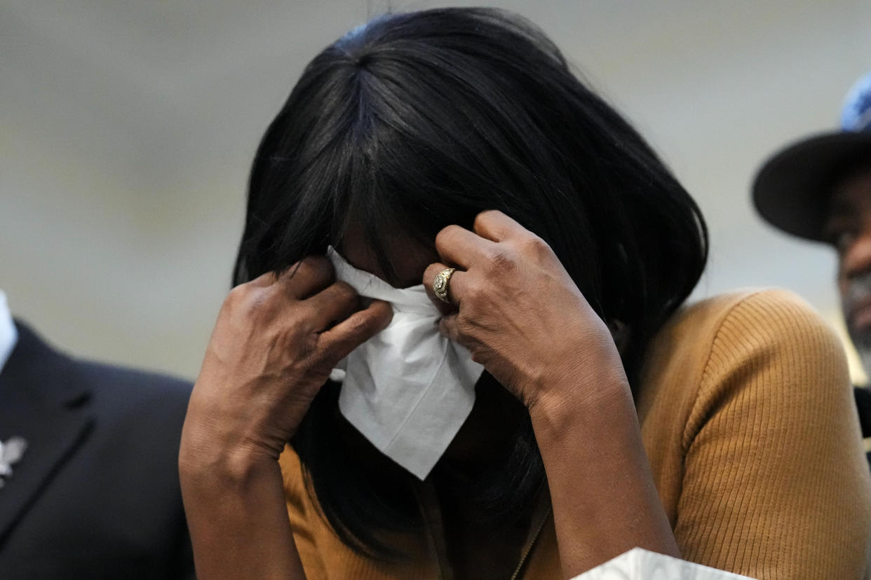 RowVaughn Wells, mother of Tyre Nichols, who died after being beaten by Memphis police officers, reacts at a news conference with civil rights Attorney Ben Crump in Memphis, Tenn., Friday, Jan. 27, 2023. (AP Photo/Gerald Herbert)