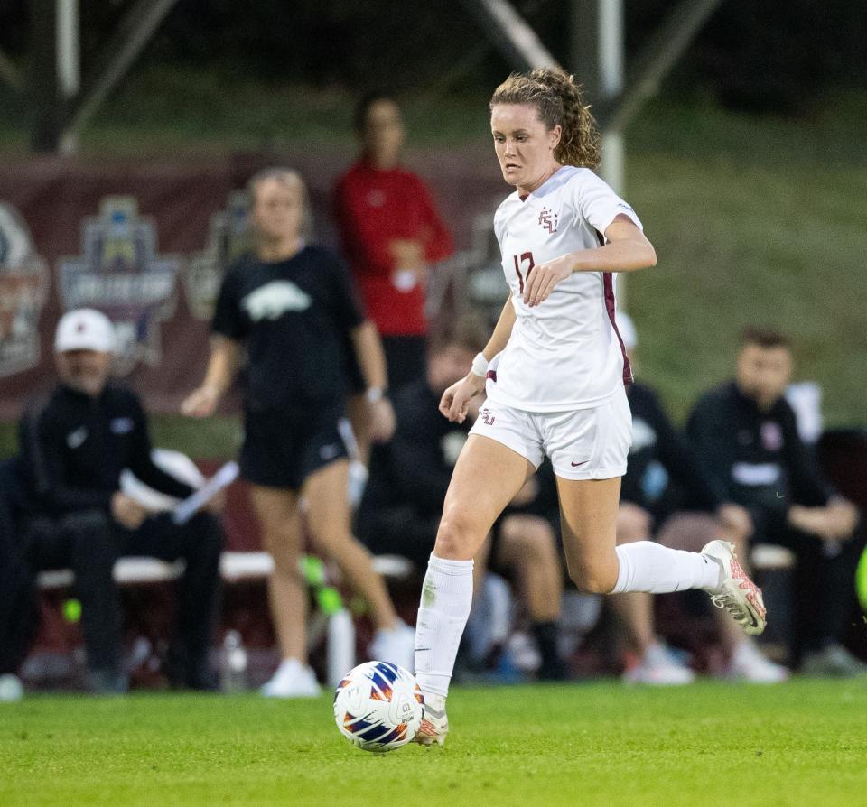 Florida State Seminole Heather Payne (12) brings the ball down the field. The Florida State Seminoles defeated the Arkansas Razorbacks 1-0 in an Elite Eight matchup Saturday, Nov. 26, 2022.