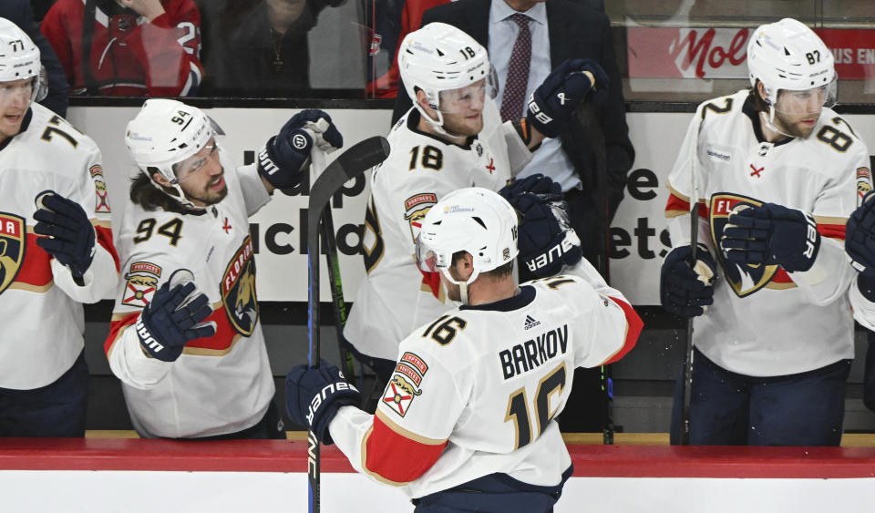 Florida Panthers' Aleksander Barkov (16) celebrates with teammates after scoring against the Montreal Canadiens during the first period of an NHL hockey game in Montreal, Tuesday, April 2, 2024. (Graham Hughes/The Canadian Press via AP)