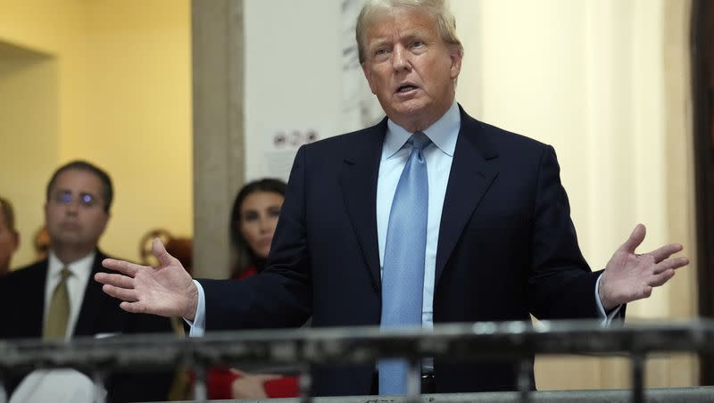 Former President Donald Trump, accompanied by members of his legal team, comments outside of his civil business fraud trial at New York Supreme Court on Wednesday, Oct. 18, 2023, in New York.