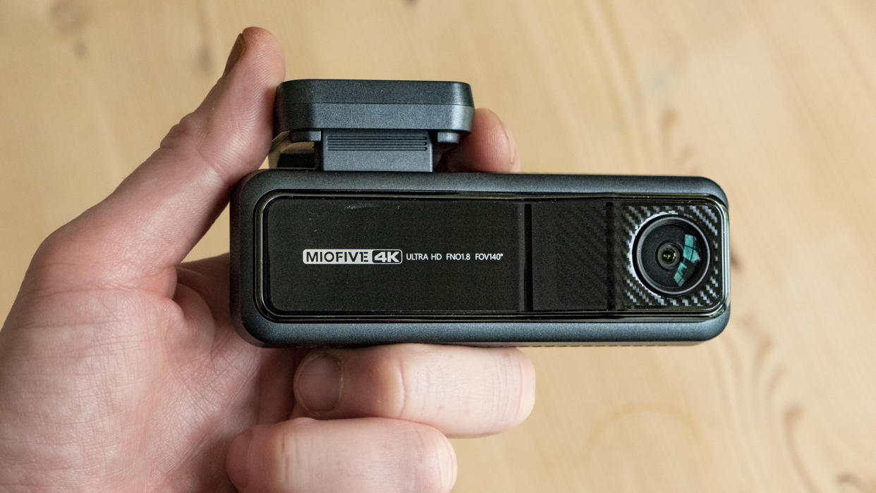  Miofive Dual Dash Cam front camera in the hand 