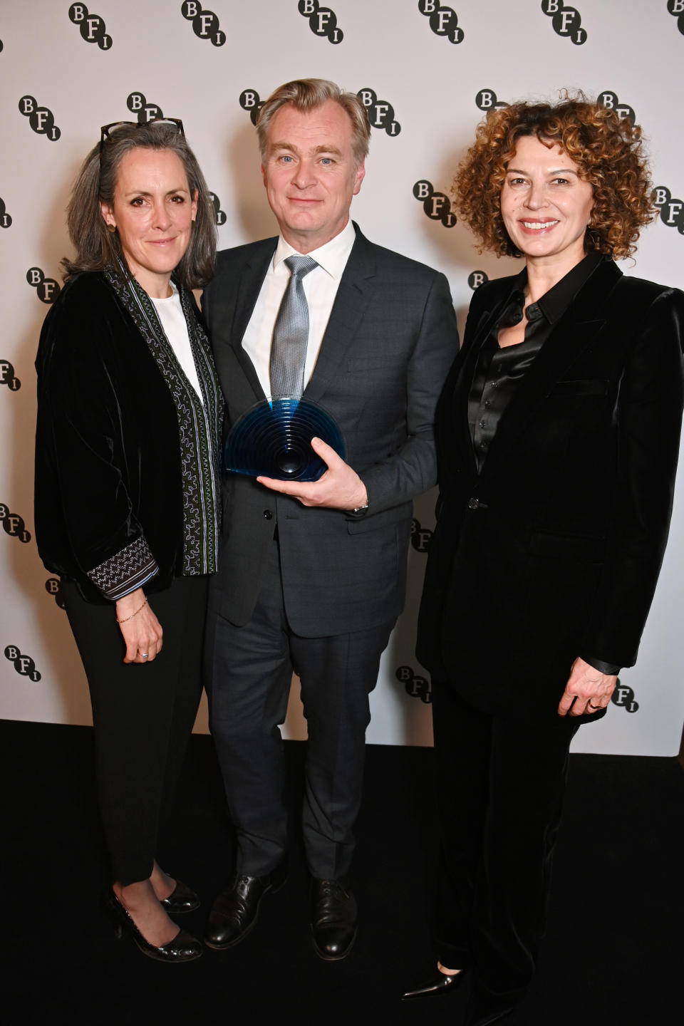 From left: Emma Thomas, Christopher Nolan and NBCUniversal Studio Group Chairman and Chief Content Officer Donna Langley at the BFI Chairman’s dinner. (Dave Benett/Getty Images)