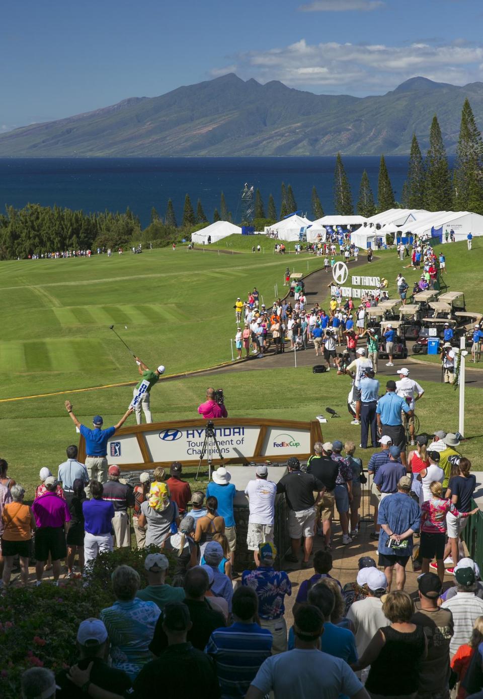 Adam Scott, of Australia, tees off on the first tee during the third round of the Tournament of Champions golf tournament, Sunday, Jan. 5, 2014, in Kapalua, Hawaii. (AP Photo/Marco Garcia)