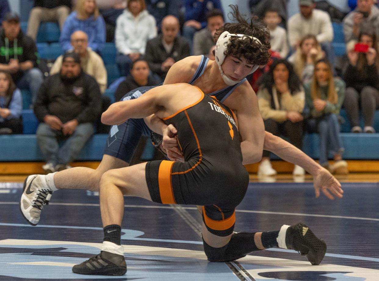 CBA freshman Paul Kenny (facing the camera) is shown during his bout with Middletown North's Brady Klinsky Thursday night.