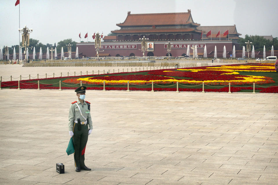 A Chinese paramilitary policeman wearing a face mask to protect against the new coronavirus stands guard on Tiananmen Square before the opening session of the Chinese People's Political Consultative Conference (CPPCC) in Beijing, Thursday, May 21, 2020. (AP Photo/Andy Wong, Pool)