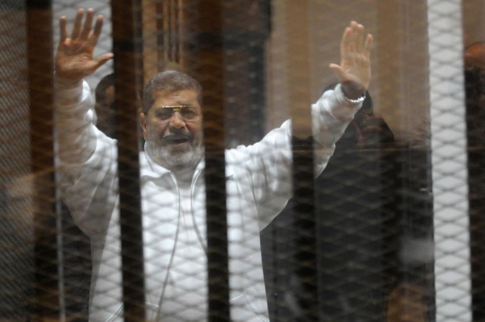 Mohamed Morsi, a senior member in the Egyptian Muslim Brotherhood, came out of comparative obscurity when he was named Egypt’s first democratically elected president, in an election held in the messy aftermath of the 2011 revolution.He died asking to speak in a soundproof cage in a courtroom just seven years later.His legacy will be a complex and sad one.Morsi wasn’t even the Brotherhood’s first choice as their presidential candidate in 2012. Khairat al-Shater, the leader believed to be the true political and financial power behind the group’s throne, had been disqualified on the grounds that he had been released from prison just the year before.Morsi meanwhile, an engineer and university professor, was short, unimposing, and teased for having little charisma.He was even lumbered with the nickname "spare tyre" in Arabic.At the beginning, as the country’s establishment was rocked by the millions of Egyptians demonstrating in the 2011 Arab Spring protests, the Brotherhood at remained on the sidelines and resisted joining.Sensing they were at a turning point in the country's history the group joined during the 18 days – a key tipping point in Egypt’s revolution, with their support instrumental in forcing Mubarak to step down.But in the months after his resignation was announced the group ordered their members to leave Tahrir Square, even as the largely secular revolutionaries continued various sit-ins – igniting distrust between January 25 revolutionaries and the Islamist group.Some even accused the Brotherhood of doing deals with the military in the aftermath of the revolution, during bloody street battles between protesters and the security forces.Yet the nation held its breath the day the presidential results were announced in early June 2012, as Morsi was propelled to the position of Egyptian president.He had been competing against Hosni Mubarak’s last prime minister Ahmed Shafik - a man who had been labelled “feloul”, or remnant, of the last and hated regime.For many Egyptians, anything was better than the Mubarak regime they had just ousted - even some secular revolutionaries had rooted for Morsi in the elections.But he wasn’t a particularly popular or effective president.Economically, the country did not recover much in the one year he was in office, instead Egypt was blighted by power cuts.Politically it was fraught.His first move in office as to push through changes to the country’s constitutional declaration placing himself above judicial oversight, banning challenges to his decree, laws and decisions.Opposition figure Mohamed El Baradei at the time dubbed him a “new pharaoh.”He appointed a then little known member of the Supreme Council of the Armed Forces to be his defence minister - Abdel Fattah al-Sisi.Mr Sisi would later oust him and take the presidency himself.At the time, ironically, Mr Sisi’s appointment was seen to be the Muslim Brotherhood wrestling power from the military who had been in charge since the removal of Mubarak.The new constitution Morsi oversaw was drafted by a constituent assembly dominated by conservative Islamist figures including Salafi groups, sparking fears among secular and Christian communities within the country.Among the discussions, which did not lead to any concrete articles but still prompted serious concerns, were suggestions the marital age be lowered.It was passed in December 2013 with 64 per cent of the votes, but opposition called for an investigation into results saying the polls were fraudulent.A seemingly spontaneous protest group - under the name Tamarod or “rebellion” - was gathering force at this point.Its members claimed to have collected over 20 million signatures calling for Morsi to step down.On the streets of Cairo, it was common to see people with photocopied sheets of their demands that citizens could sign.It was an act of defiance that at first seemed to sum up the national frustration with the Muslim Brotherhood, but quickly became too brazen to seem completely civilian led.The 30 June 2013 protests they called were huge - tens of thousands of people amassed in Tahrir and other squares.But among the crowds were members of the security forces, waving red football cards and shouting “Erhal” or leave. Someone had green lighted this.Morsi was defiant. In a panicked speech, delivered the 48-hour ultimatum the military gave him to resign and after the Brotherhood’s Cairo headquarters had been ransacked, he shouted that he was the “legitimate” leader of Egypt dozens of time.On the 3 July he was ousted - then he disappeared.He would not be seen again until November of that year and then only in court. He had been held, likely illegally, in different security buildings with pretty much no access to the outside world.The first court session was similarly chaotic.Morsi’s screamed that “this was not a court - this was a coup” were drowned out by chants of lawyers and journalists calling for his blood.The courtroom decended into fisticuffs when his defence team were battered by furious plaintiff lawyers shouting “execution, god willing”.He would face a bewildering number of trials. He was first tried on charges of incitement to kill protesters during clashes outside Cairo’s presidential palace in December 2012.He would then face trial for allegedly breaking free from jail in 2011, which he would be sentenced to death for in 2015. He would also be tried for espionage, the court hearing that was taking place the day he died.A year before his death, British lawyers and parliamentarians including Crispin Blunt, off the back of an independent report commissions by his family, warned that he may die in prison because he was so poorly treated.He had diabetes, hypertension and liver disease, he was held for long stretches in solitary confinement. He was denied a proper diet, sometimes medication was withheld. Until his dying day he maintained he was the legitimate president of Egypt.