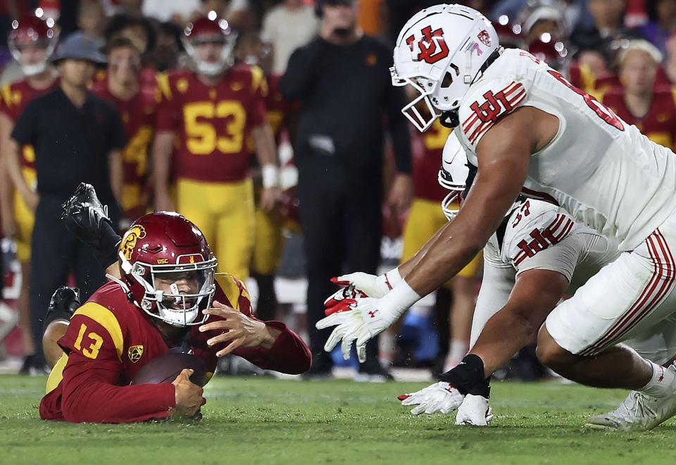 USC Trojans quarterback Caleb Williams (13) jumps on a fumble late in the game against Utah at the Los Angeles Memorial Coliseum on Saturday, Oct. 21, 2023. | Laura Seitz, Deseret News