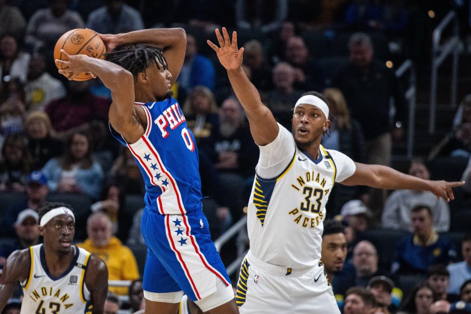 Jan 25, 2024; Indianapolis, Indiana, USA; Philadelphia 76ers guard Tyrese Maxey (0) looks to pass while Indiana Pacers center Myles Turner (33) defends in the first half at Gainbridge Fieldhouse. Mandatory Credit: Trevor Ruszkowski-USA TODAY Sports
