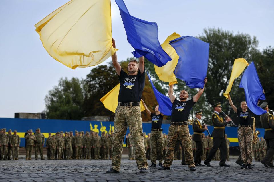 Performers attend a flag ceremony in Lviv, Ukraine, on Aug. 23, 2022. <a href="https://media.gettyimages.com/photos/performers-attend-a-ceremony-of-raising-the-national-flag-of-ukraine-picture-id1417283295?s=2048x2048" rel="nofollow noopener" target="_blank" data-ylk="slk:Jeff Mitchell/Getty Images;elm:context_link;itc:0;sec:content-canvas" class="link ">Jeff Mitchell/Getty Images</a>