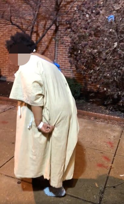 A woman was filmed wandering around outside a Maryland hospital wearing only a hospital gown and socks early Wednesday morning. (Photo: Facebook)