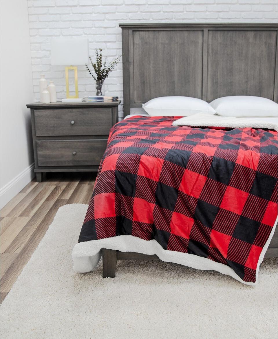 With a flannel-like cover and sherpa inside, this weighted blanket is perfect for winter. It has a removable cover that's machine washable. <a href="https://fave.co/2GYW95R" target="_blank" rel="noopener noreferrer">Originally $260, get it now for $56 with code <strong>THANKYOU</strong> at Macy's</a>. 