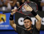 Lleyton Hewitt of Australia celebrates after defeating Zhang Ze of China in their men's singles first round match at the Australian Open 2015 tennis tournament in Melbourne January 20, 2015. REUTERS/Athit Perawongmetha (AUSTRALIA - Tags: SPORT TENNIS)