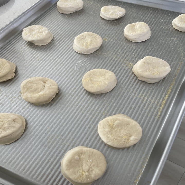 English muffins cut out on a sheet pan