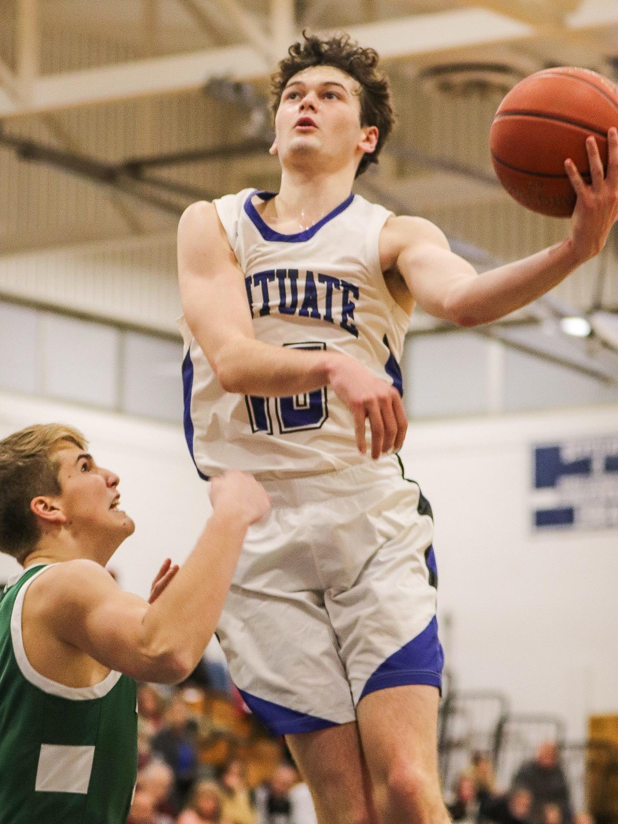 Scituate's Michael Porter attacks the basket during a game against Marshfield at Scituate High School on Wednesday, Feb. 14, 2024.