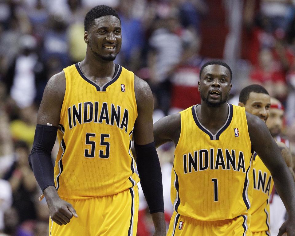Indiana Pacers center Roy Hibbert (55) smiles as he walks across the court with Indiana Pacers guard Lance Stephenson (1) in the closing minutes of the second half of Game 4 of an Eastern Conference semifinal NBA basketball playoff game in Washington, Sunday, May 11, 2014. The Pacers won 95-92. (AP Photo/Alex Brandon)