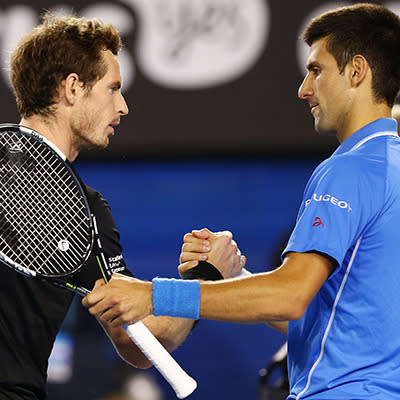 Murray and Djokovic shake hands at the net.